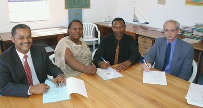 Government Officials and Community Leaders sign an agreement to build the Masiphumulele Secondary School