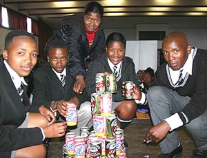 learners building a tower with empty cans