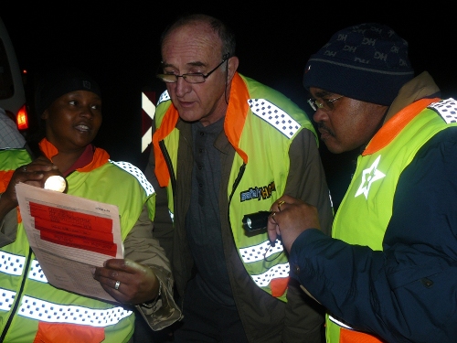 MEC The MECs inspecting an operating licence and finding that it has expired and that the vehicle is not allowed to operate on the route.