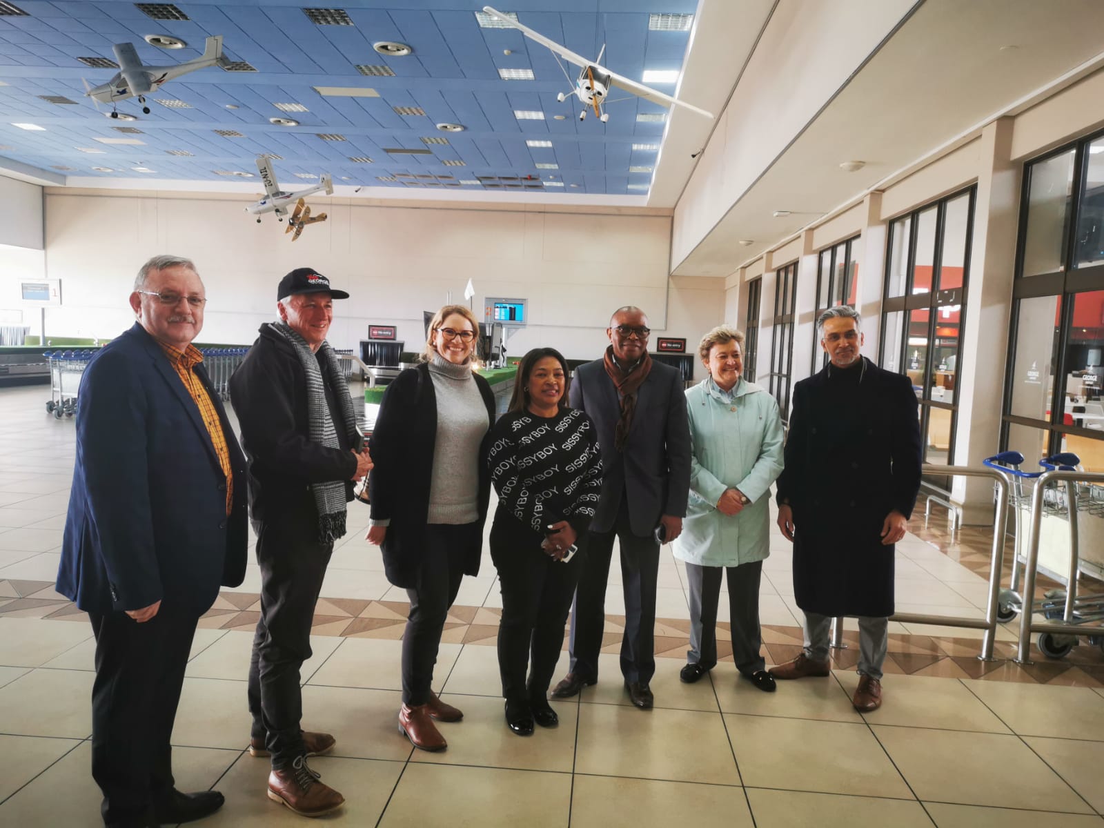 Minister of Finance and Economic Opportunities, Mireille Wenger, at George Airport with Mayor Van Wyk, Airport Manager, Brenda Voster, DEDAT HOD, Velile Dude, George MM, Dr Gratz, and DEDAT DDG, Rashid Toefy