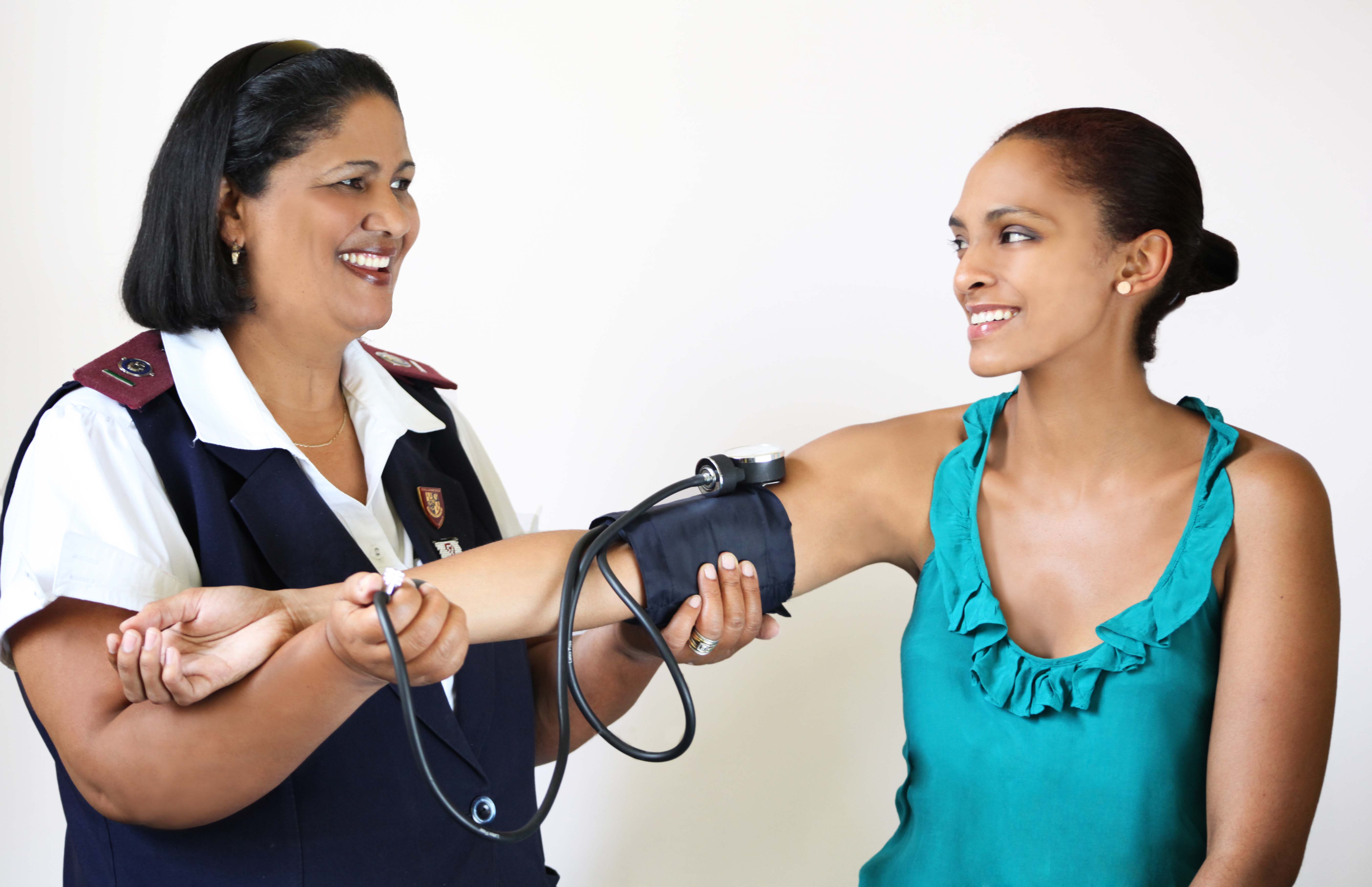 Healthcare professional measuring blood pressure.
