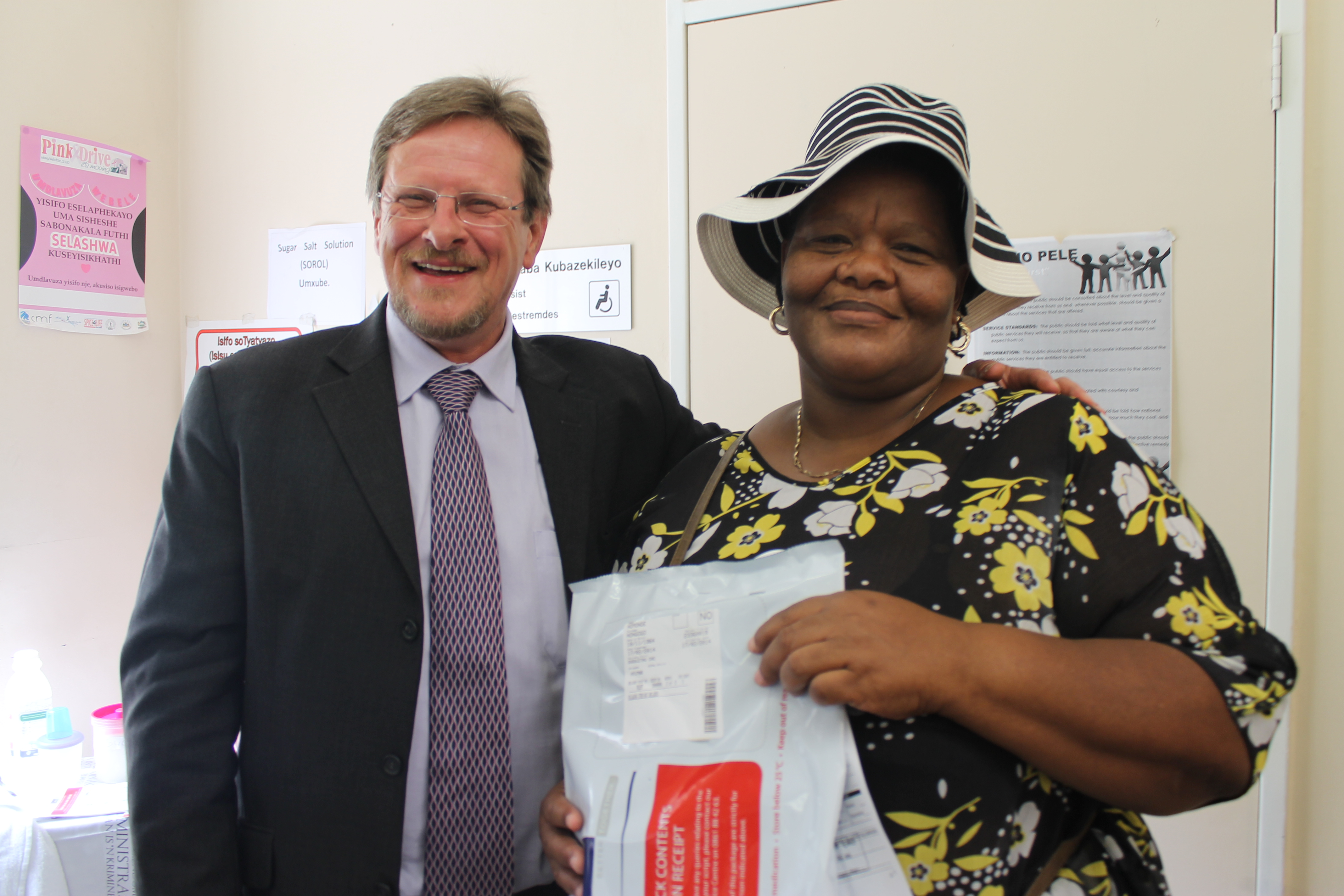Nomonde Patience Nongogo (50) received the 5th million chronic medication parcel from the Western Cape Minister of Health, Mr Theuns Botha at the Gugulethu Community Health Centre.