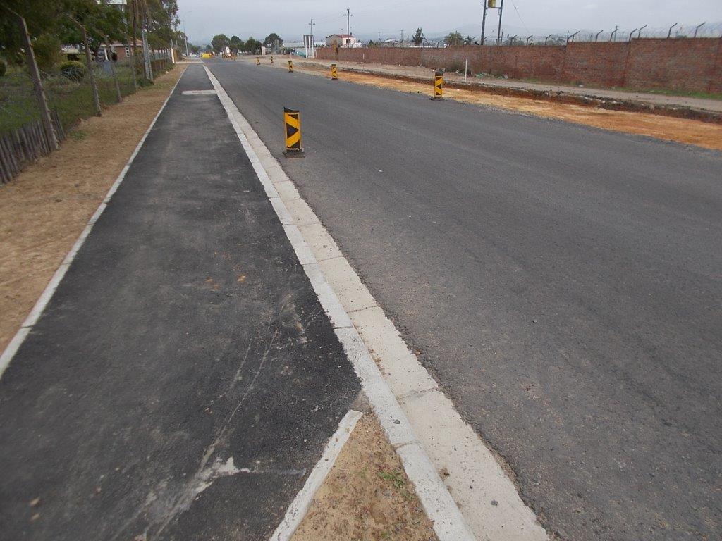 A side walk  provides pedestrians with a safe area to walk between the communities of Bloekombos and Denovo.