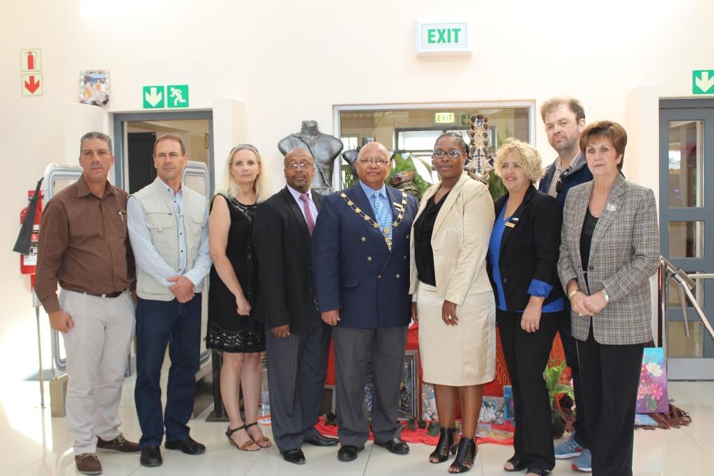 Ald. Francois Schippers and Nomaza Dingayo with representatives of the Saldanha Bay Muncipality