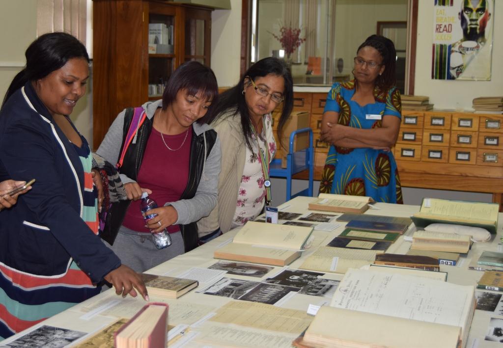 Archivist, Amanda Mdawe (left) assisting Public Administration learners from the Cape Peninsula University of Technology at the Education Exhibition in the Archives Library.