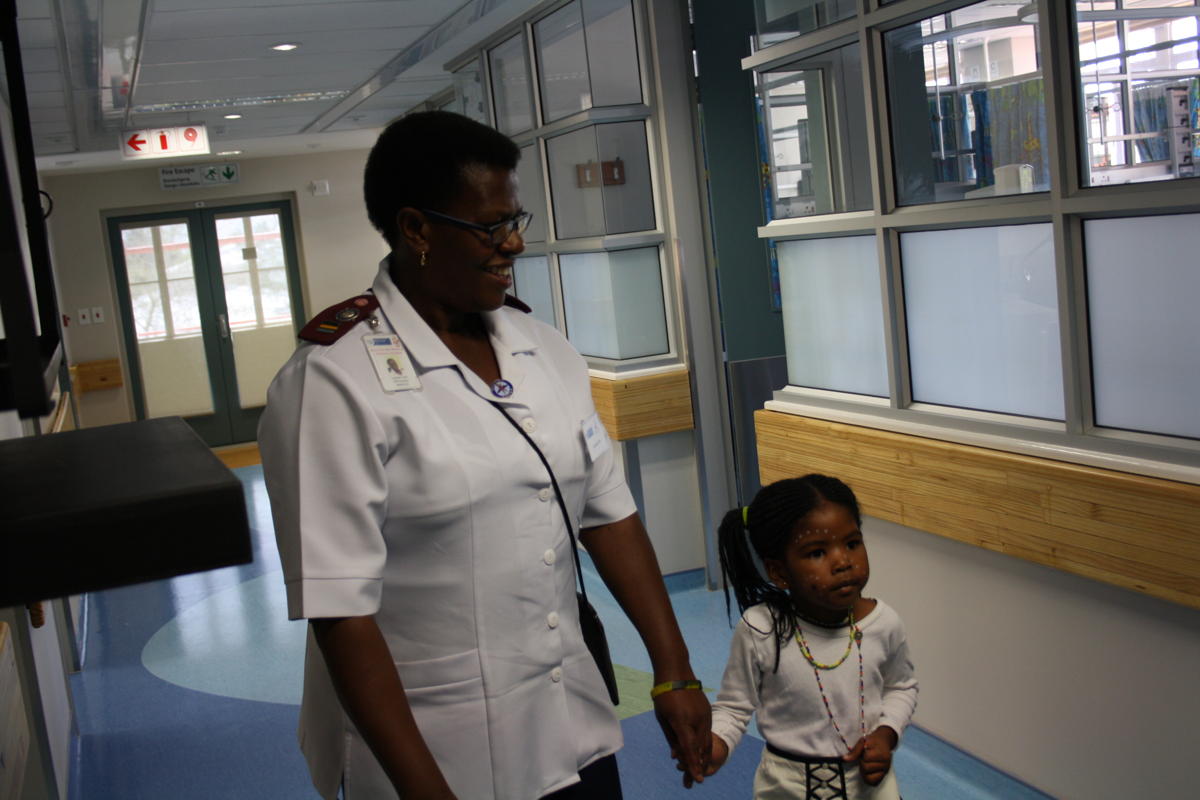 Sr Lindiwe Teto, Operational Manager: Ward B2, gives patient Lindokuhle Dlakavu a guided tour of the newly upgraded ward.