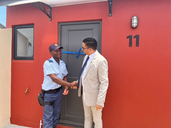 Blue Rise help me buy a home beneficiary receive his house keys from Minister Simmers