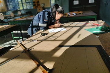 Candra doing technical drawing