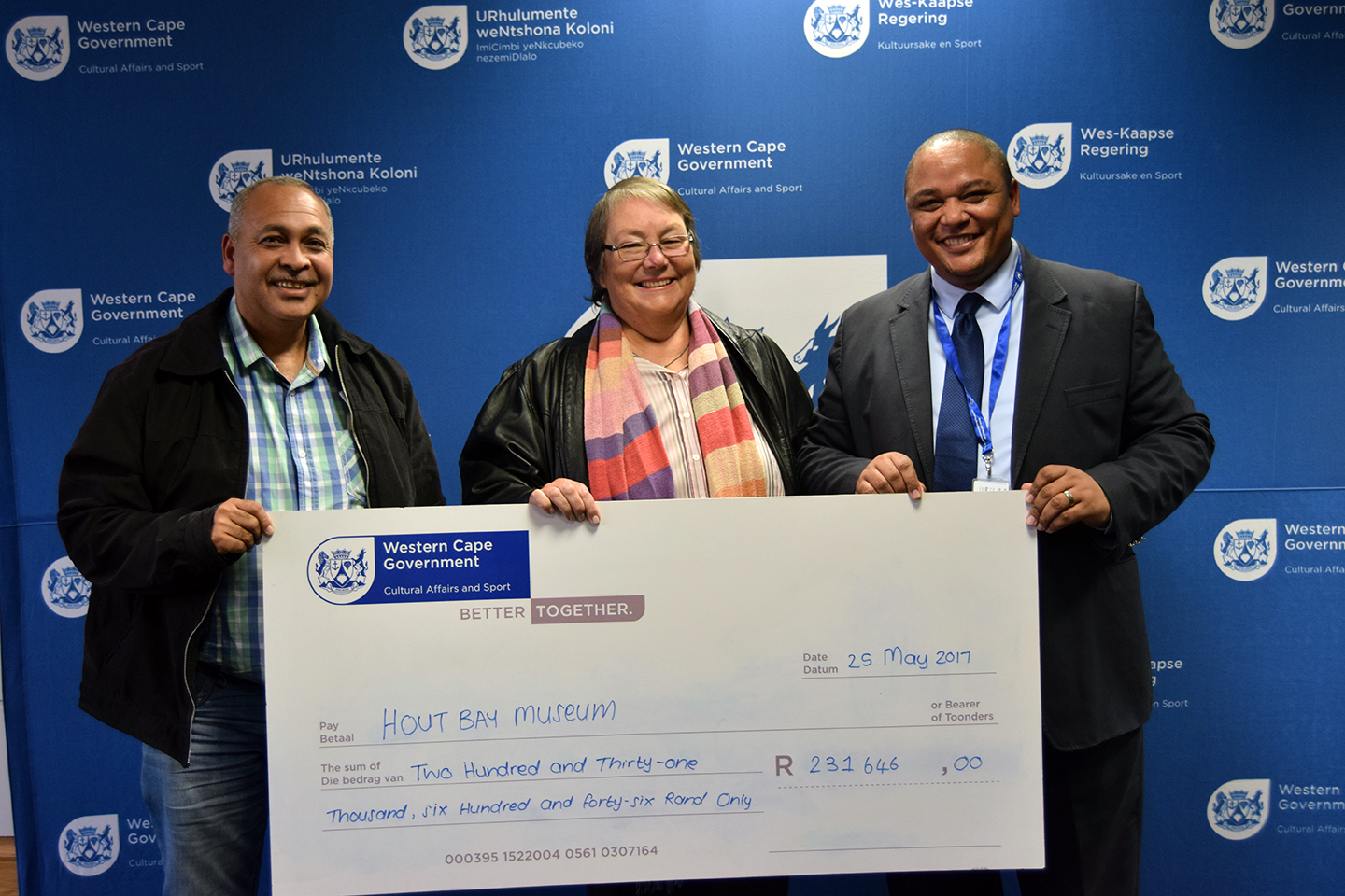 Hout Bay Museum receives their ceremonial cheque from Guy Redman