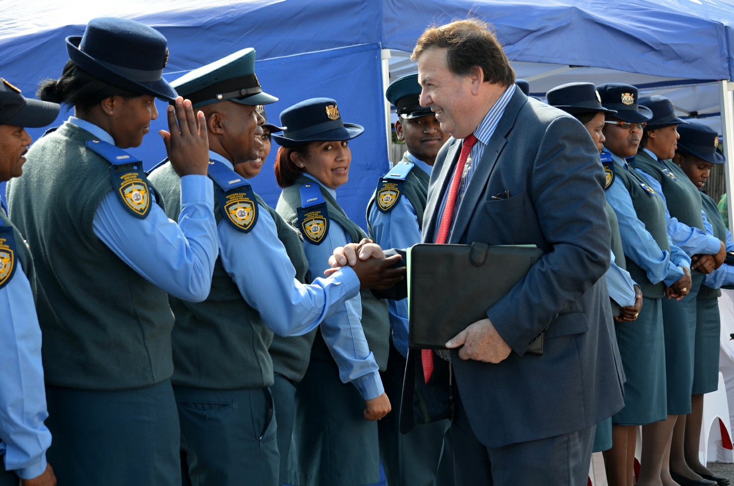 Minister Donald Grant greets traffic officers at the official opening of the new Knysna Traffic Centre.