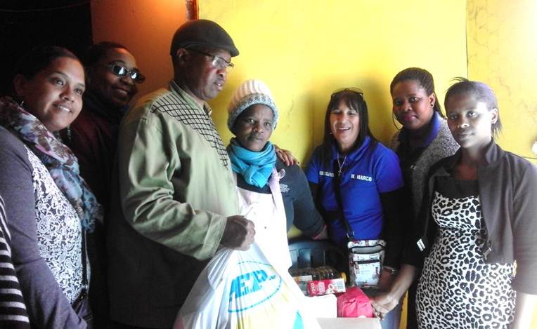 Colleagues from Khayelitsha Local Office handed over food hampers, contributed by staff members, to a families in need.