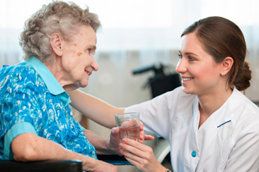Nurse Caring for Elderly Person