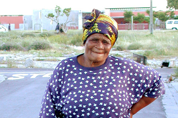 elderly lady on the side of the road