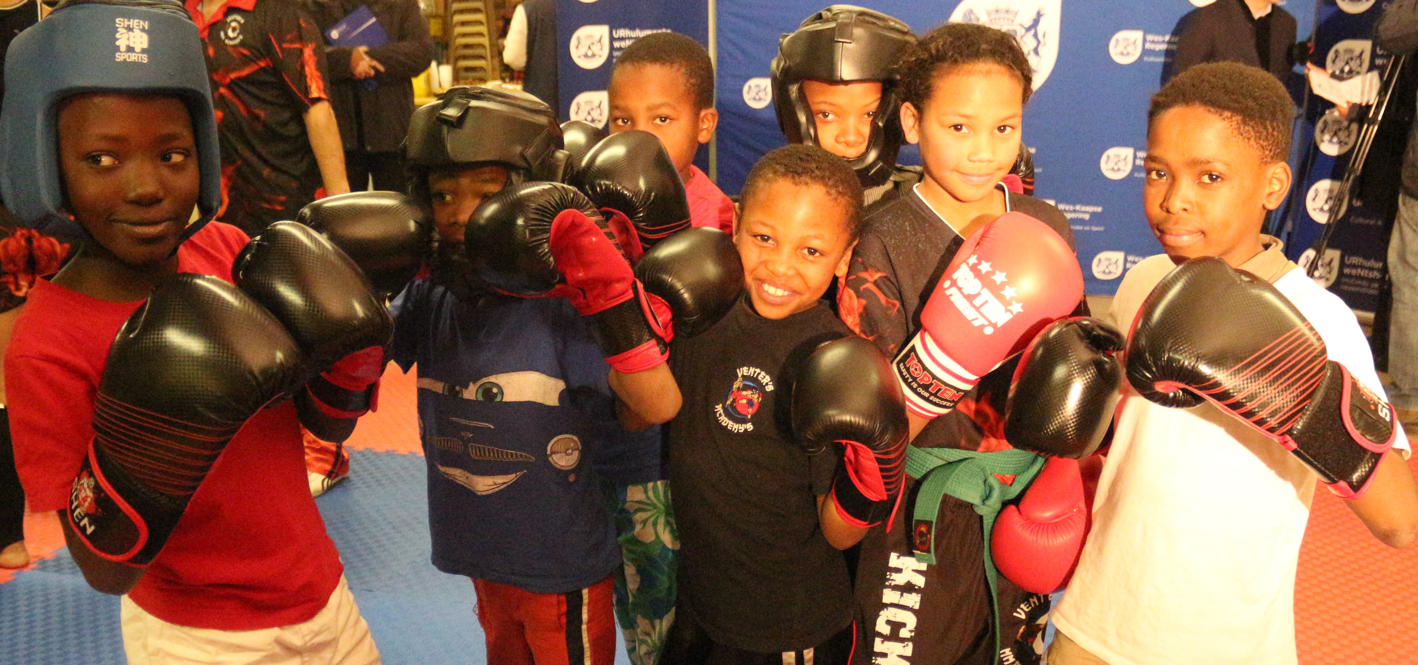 Excited kick-boxers who are expected to benefit from the club.