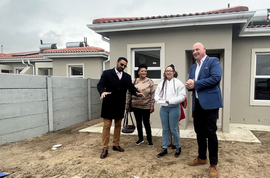 Provincial Minister of Infrastructure, Tertuis Simmers, alongside Mayoral Committee Member (MMC), James Vos, handed over house keys to 10 beneficiaries at the Our Pride housing project, in Eerste River.