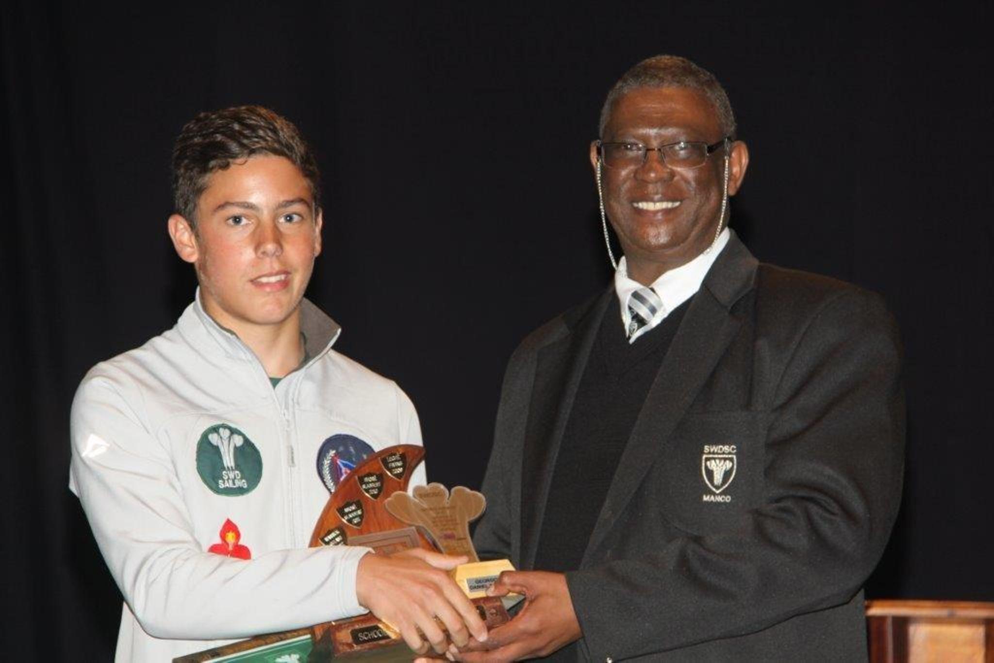 Georgou Divaris (School Sportsman of the Year) with Goliath Munro (SWD Sport Council).