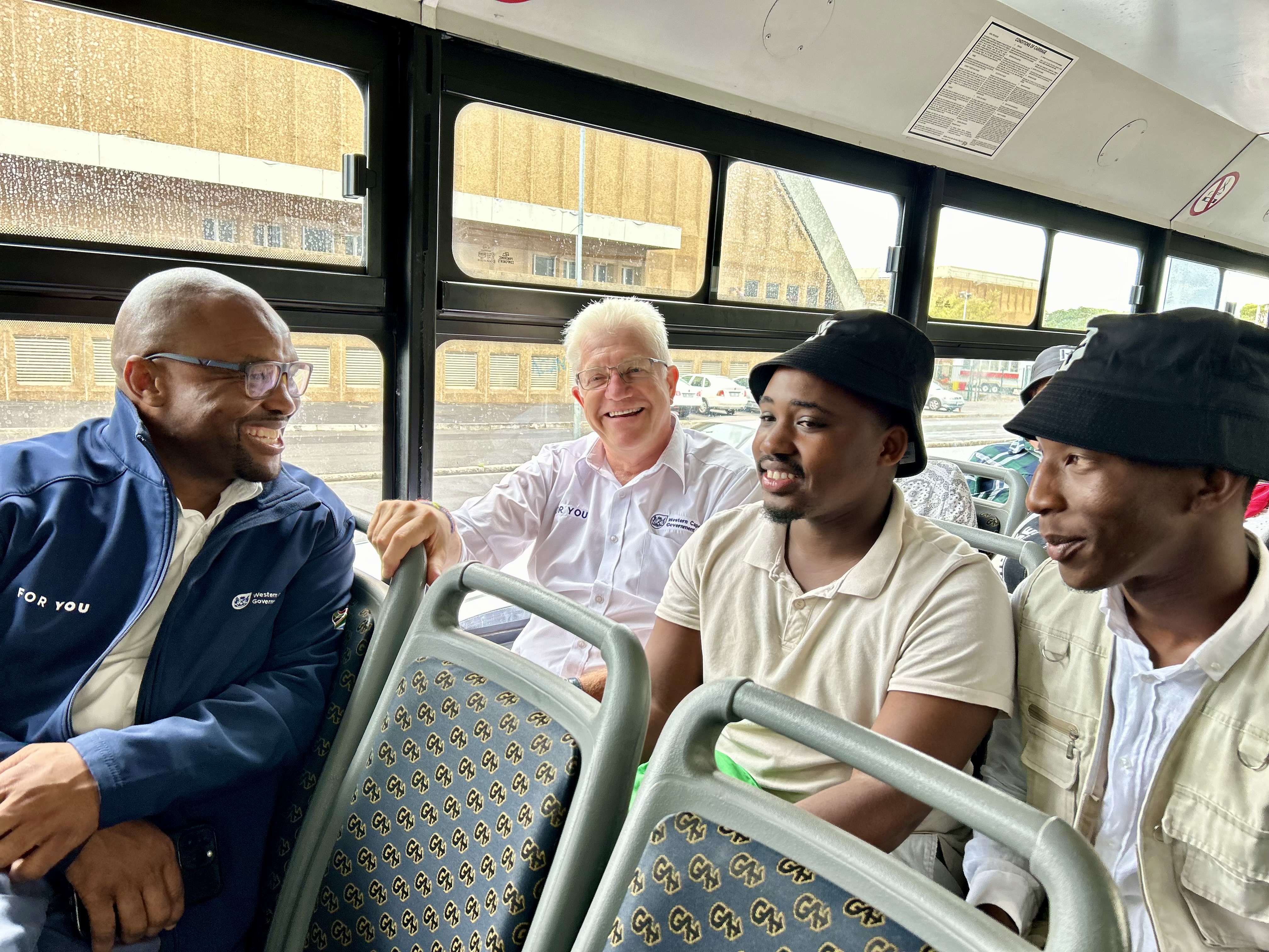 Mobility Minister Ricardo Mackenzie and Premier Alan Winde join interview candidates Latita Memani and Yongama Sondlo using their Getting YOU to Work free transport voucher.