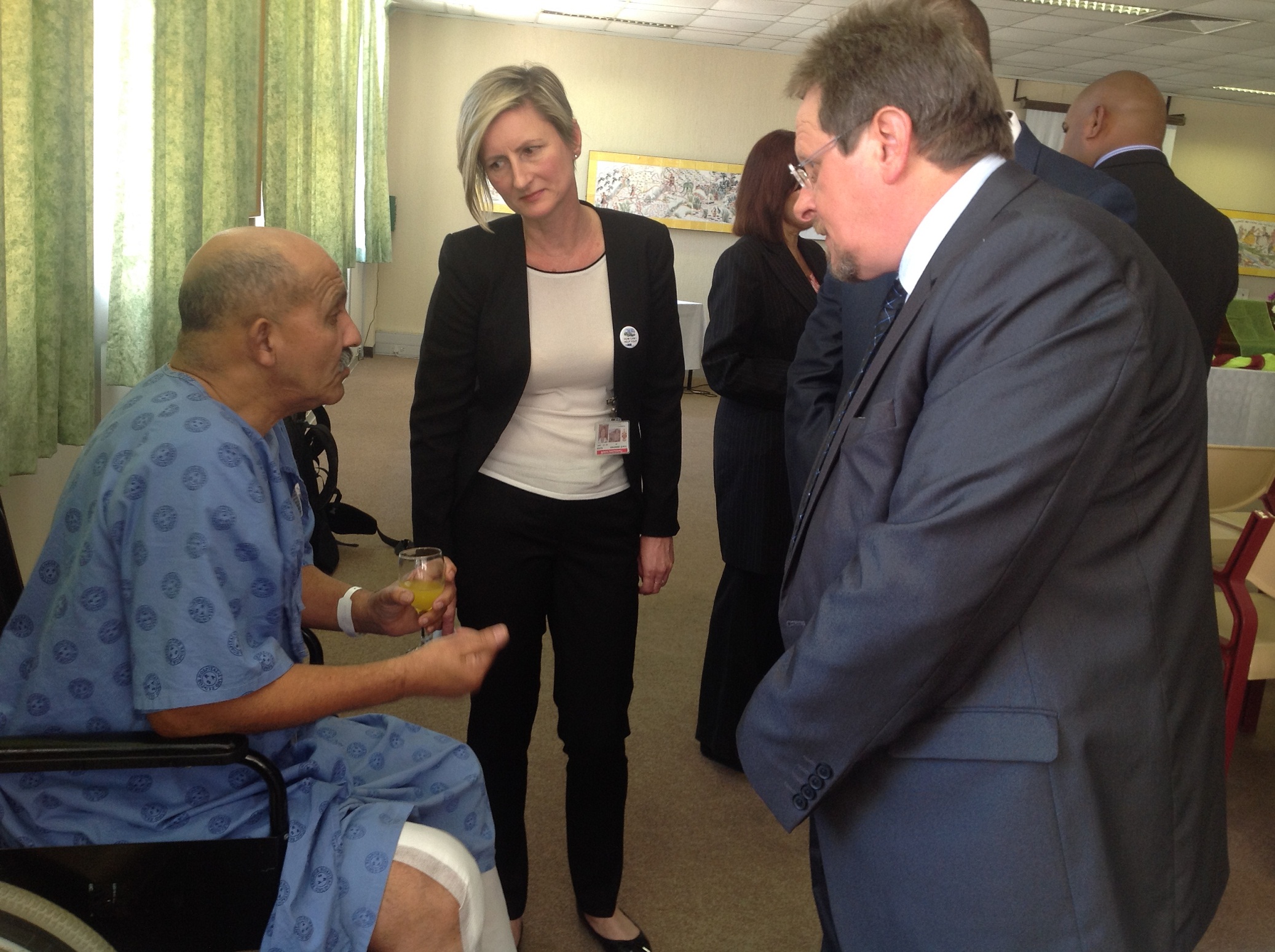 Minister Theuns Botha and Dr Agata Krajewski,Medical Superindent at Groote Schuur Hospital, speak to one of the patients Mr Vernon Scott.