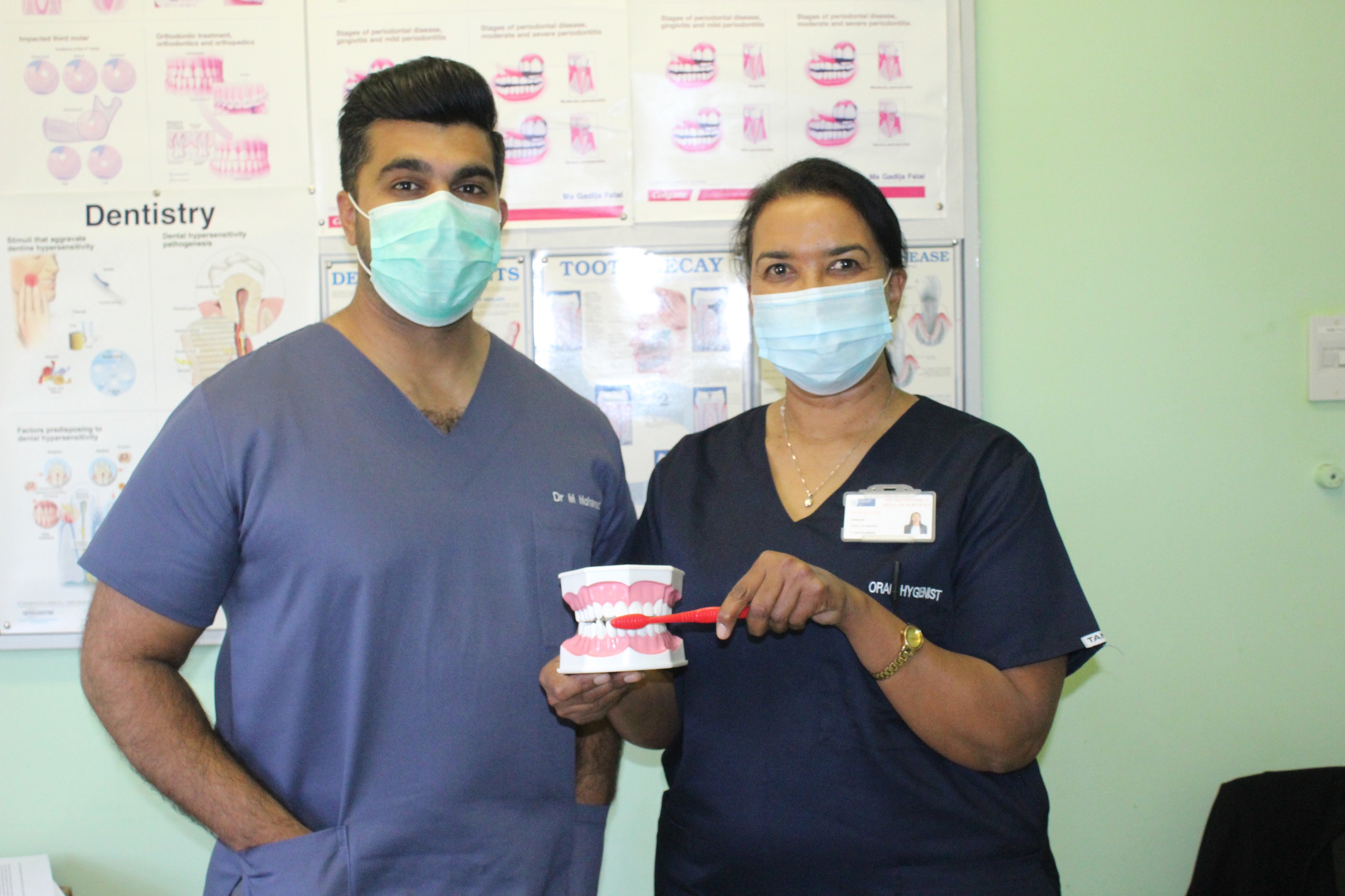 Showing us how to practice good oral health hygiene is Dr Mansoor Mohamed, dentist at Hanover Park CHC with Silvertown Clinic’s Oral Hygienest, Tania Woodman.