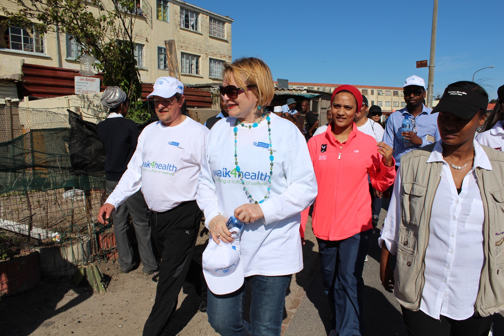 Western Cape Minister of Health Theuns Botha and Premier Helen Zille join Hanover Park residents on a community walk.