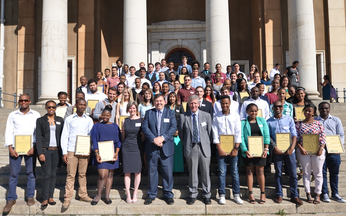 Minister Grant and Ms Gooch with the Masakh'iSizwe bursary recipients.