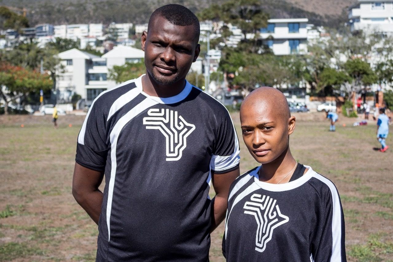 Man and Lady wearing soccer togs