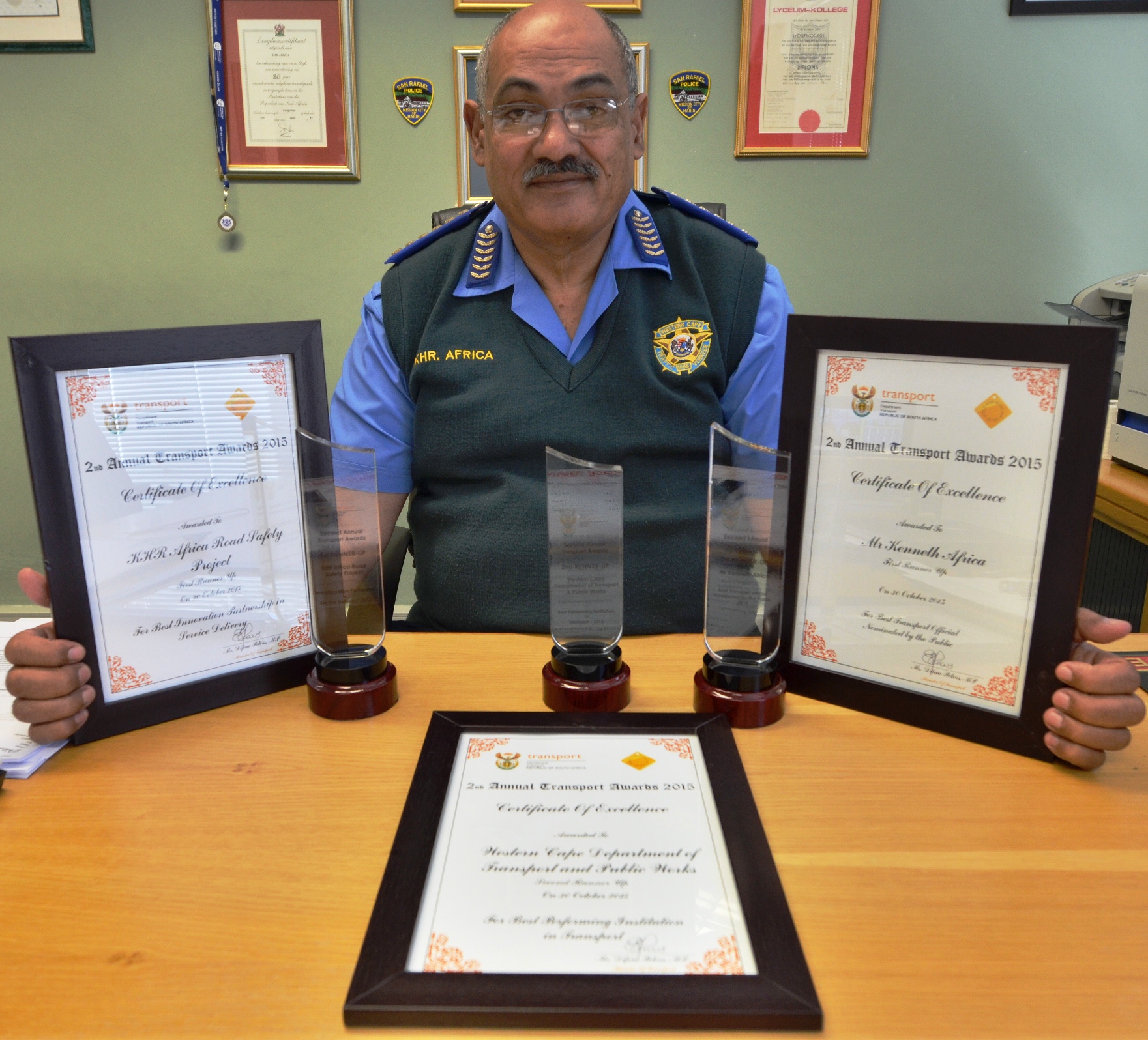 Kenny Africa with the three awards he collected in Bloemfontein.