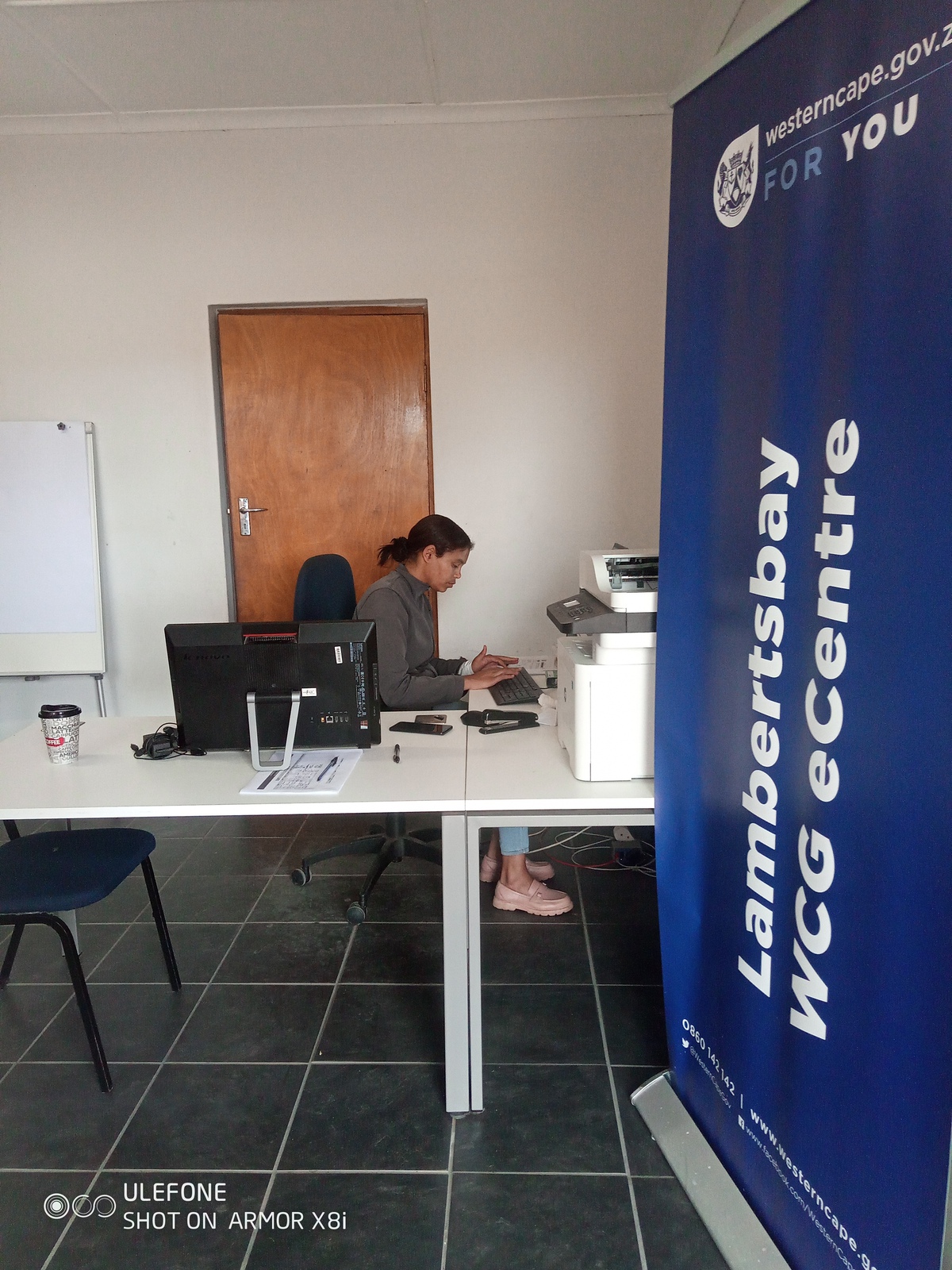 A staff member sitting at the Lamberts Bay eCentre 