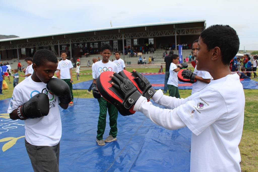 Learners excitedly participating in a kick boxing demonstration.