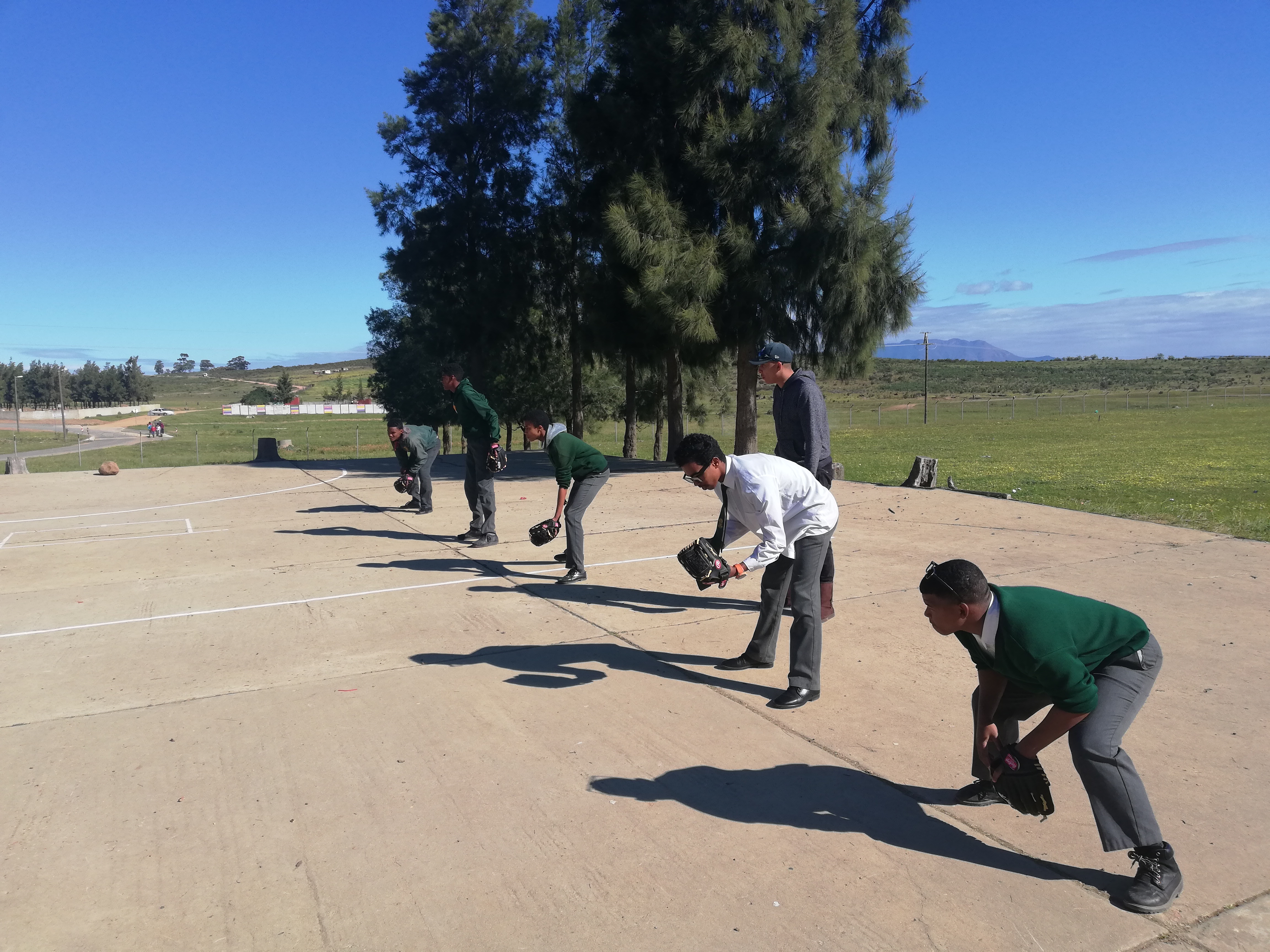 Learners learn the basics of softball at the Olympic Values roadshow in Saron