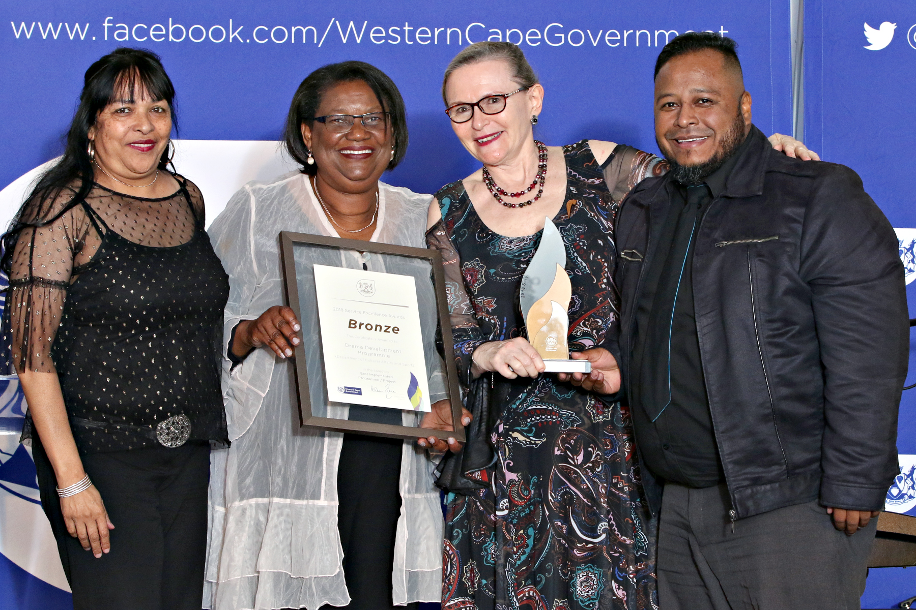 Leonora Cupido, Director Jane Moleleki and Moeniel Jacobs from Arts and Culture receive their bronze award from Premier Zille