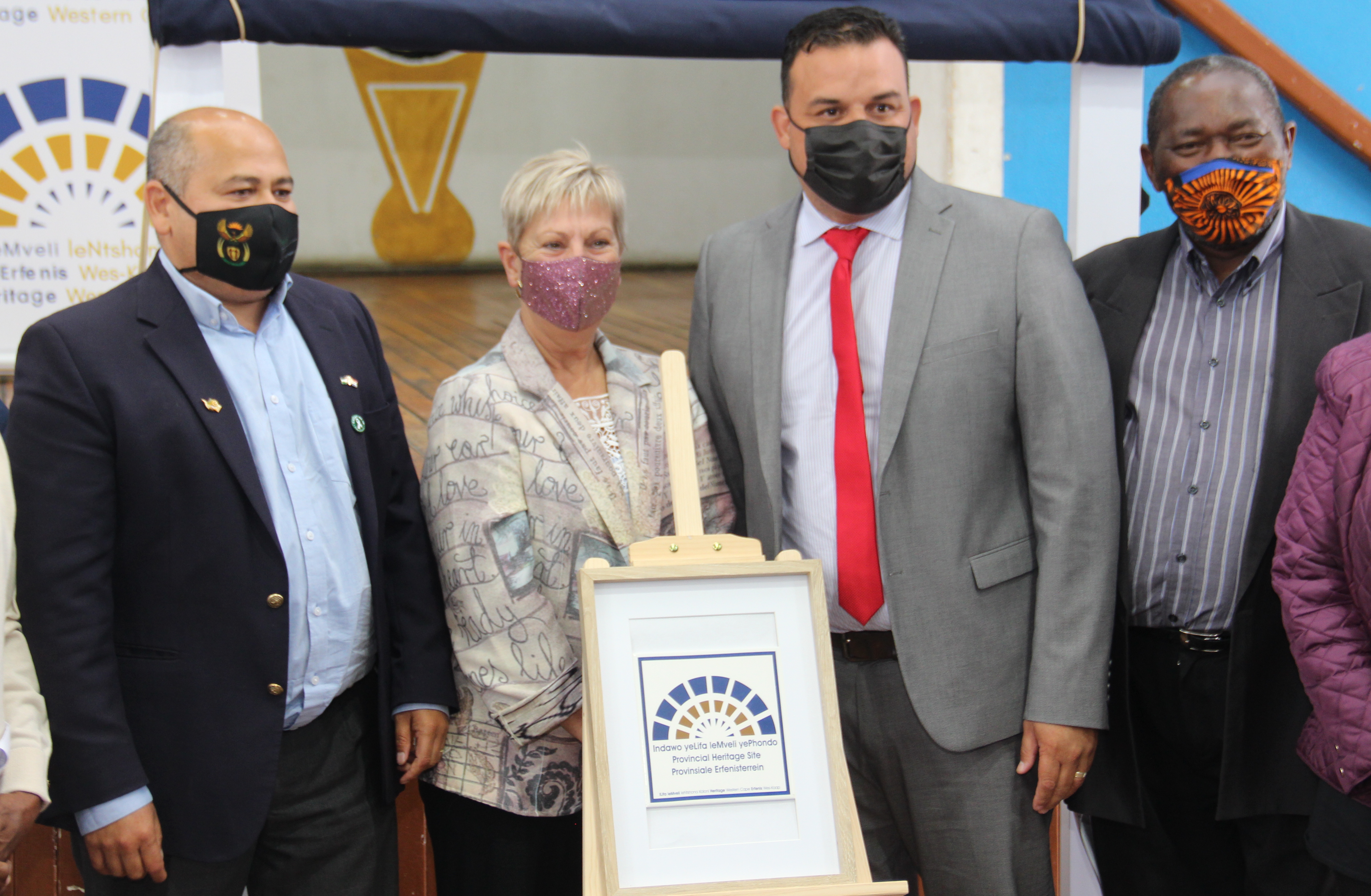 Member of Parliament, Faiez Jacobs; Minister Anroux Marais; Cape Town councillor, Angus Mckenzie; and Advocate Mandla Mdludlu of the Heritage WC council (L-R) unveil the new plaque.