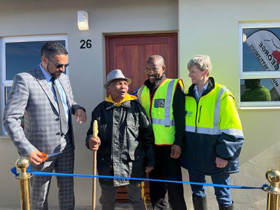 Provincial Minister of Infrastructure, Tertuis Simmers, handed over 24 brand new houses to qualifying beneficiaries at the Metro Grounds Development in George