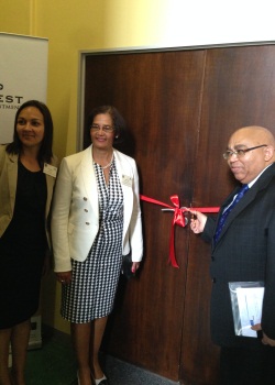 Minister Albert Fritz cutting the ribbon to the new Reading Room