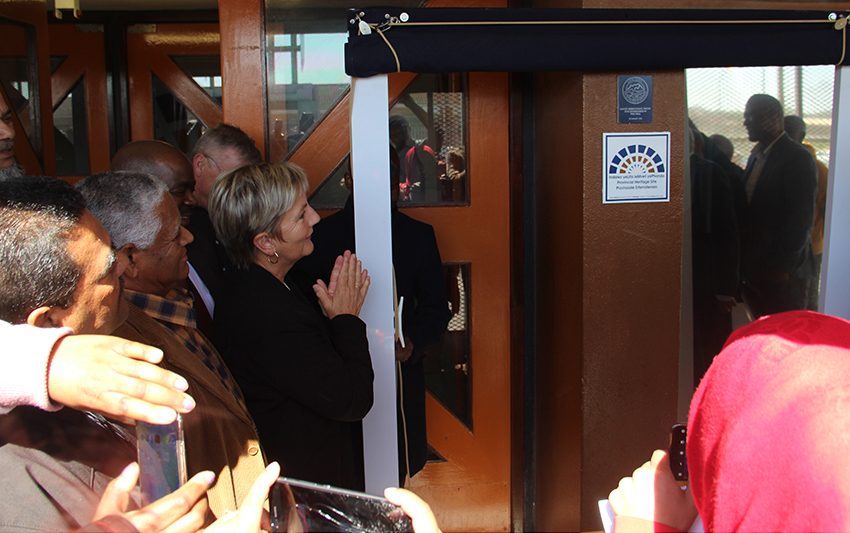Minister Anroux Marais (left) unveils the new Heritage Western Cape plaque at the Rocklands Community Centre in front of a crowd of onlookers in Mitchell’s Plain on Tuesday.