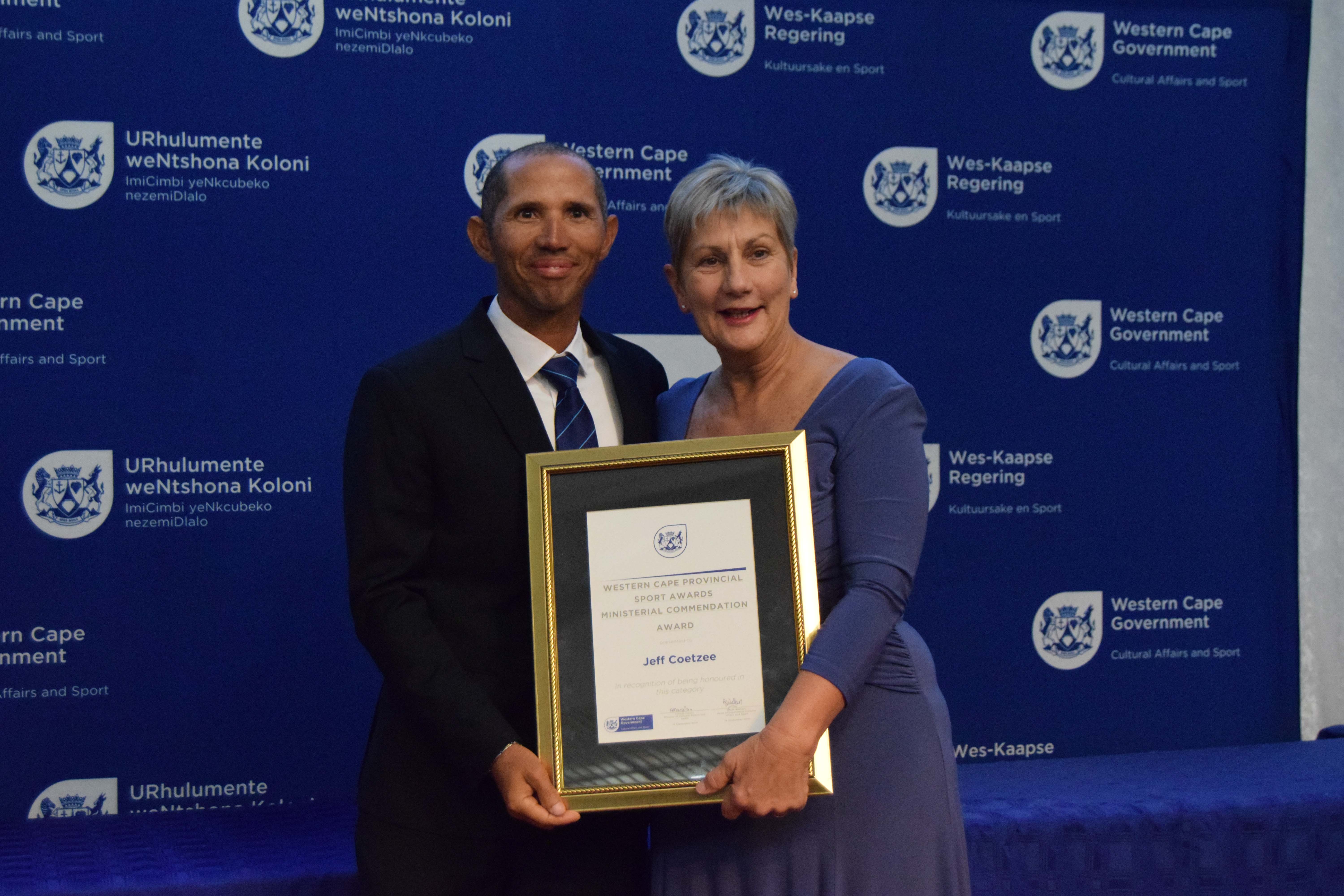 Minister Anroux Marais with Jeff Coetzee, recipient of a Ministerial Commendation