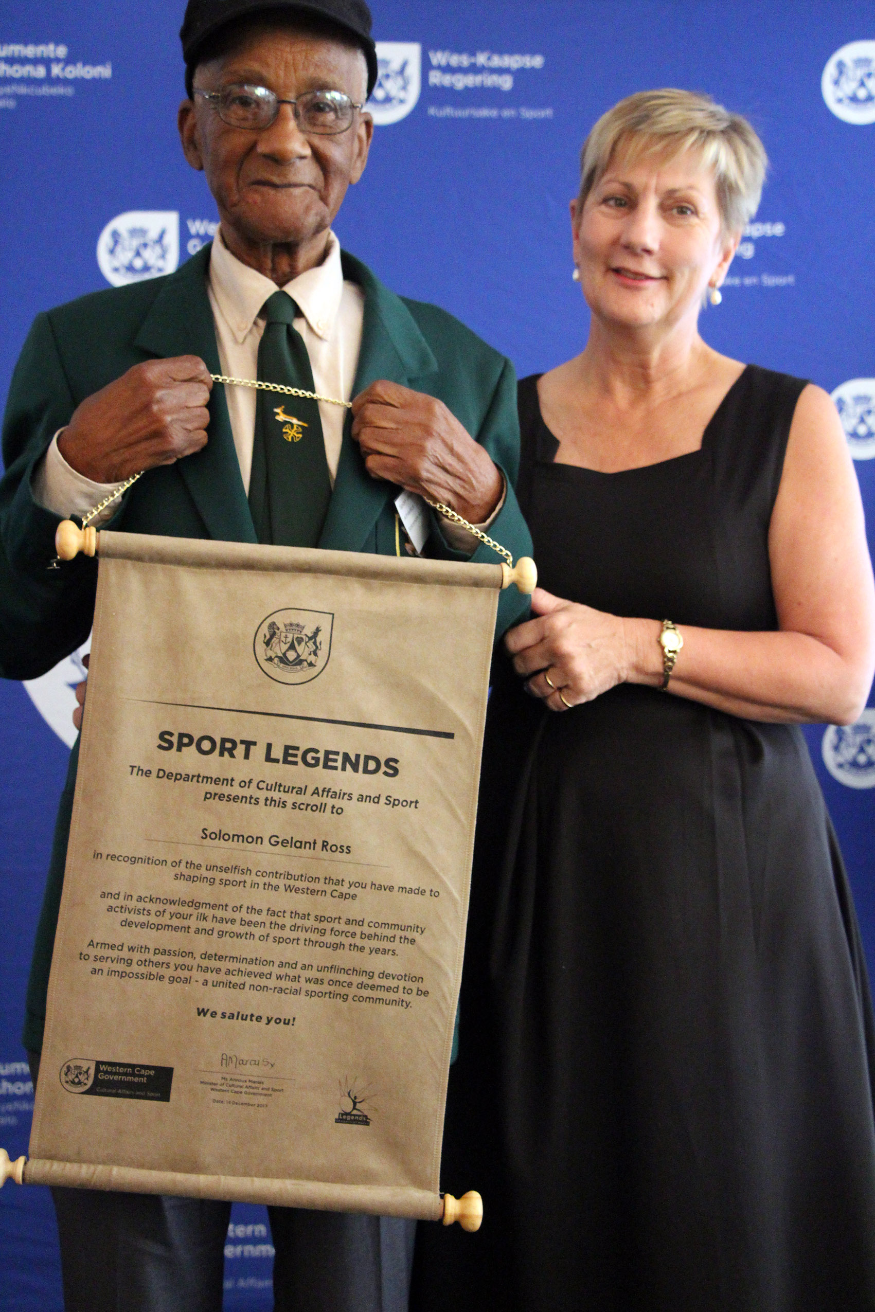 Minister Anroux Marais with Solomon Ross, an athletics legend
