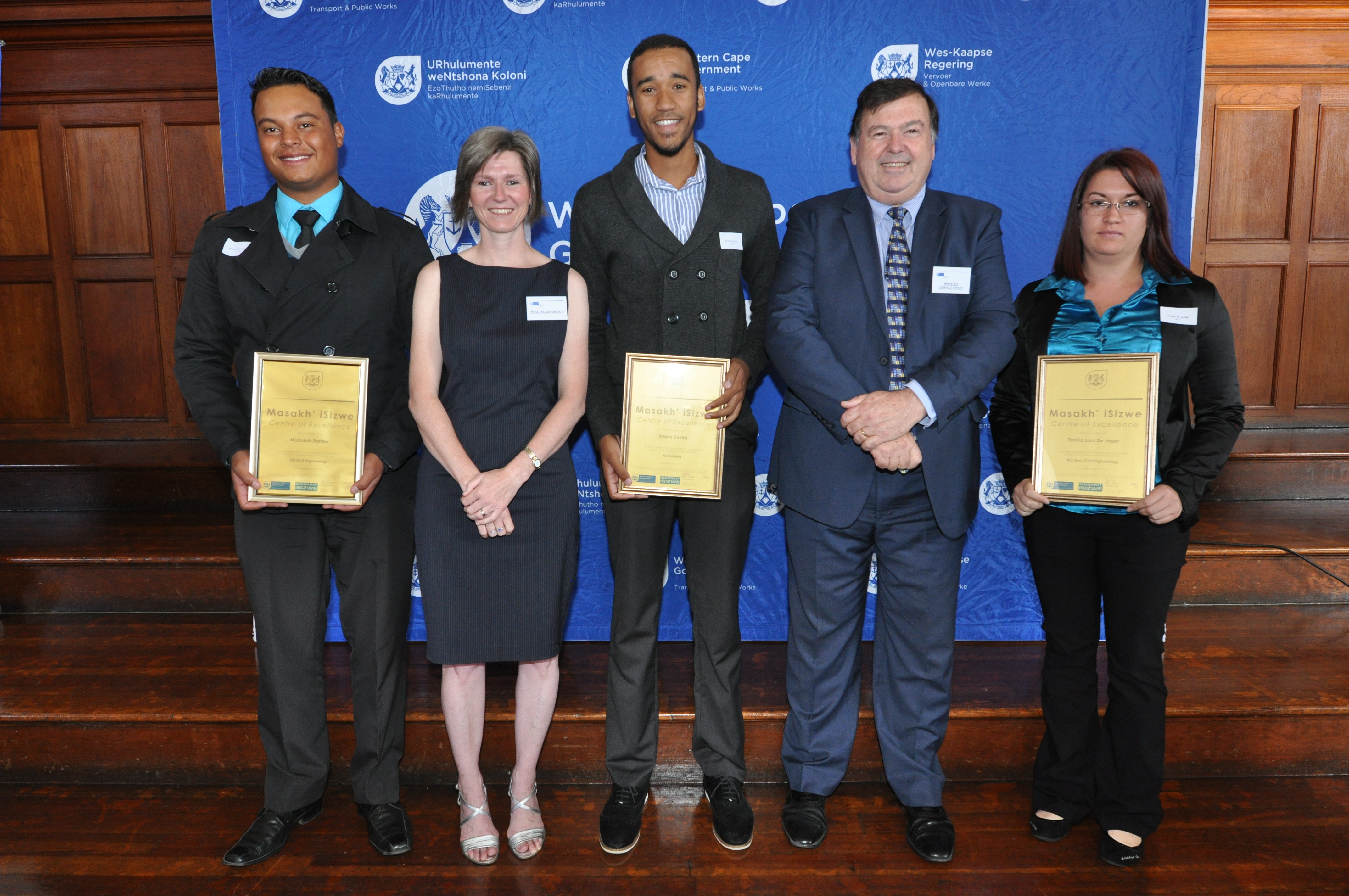 Ms Jacqui Gooch and Minister Donald Grant with three of the 86 award recipients.  
