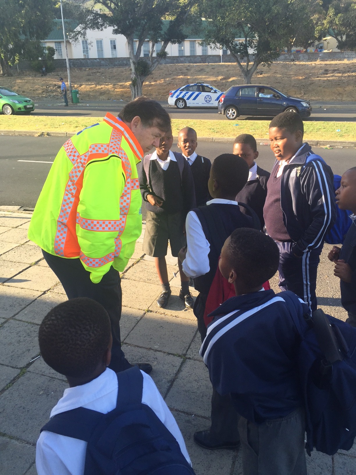 Minister Grant talking to learners about their safety at this morning's scholar transport operation.