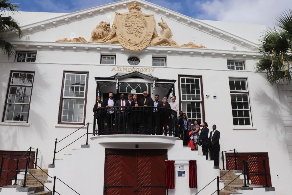 Minister Anroux Marais with stakeholders at the impressive facade of the Old Granary Complex