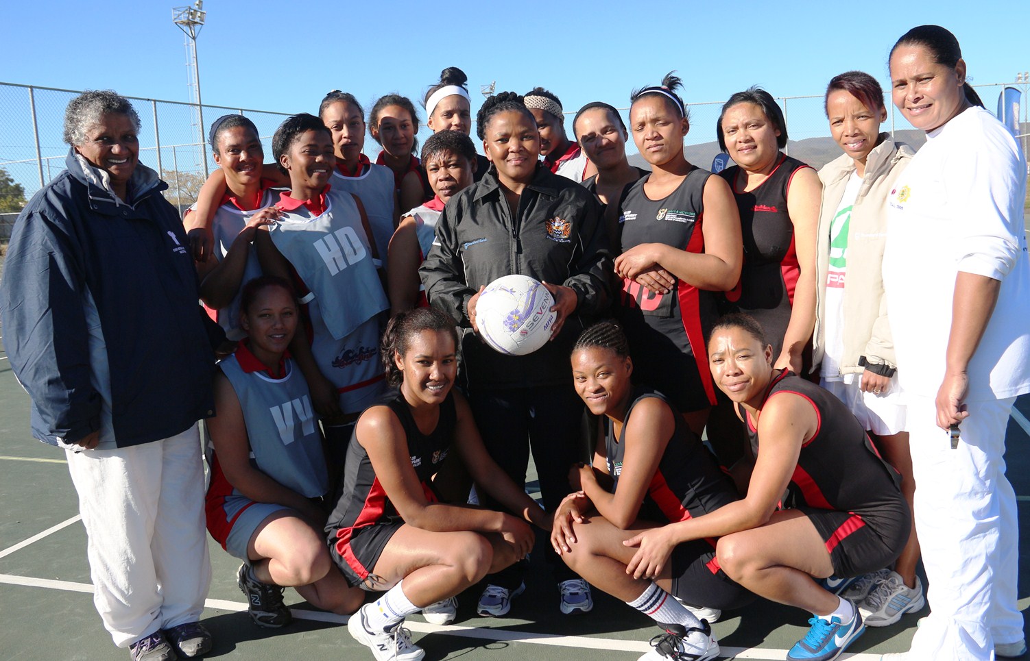 Minister Mbombo with netball players and representatives at the Oudtshoorn Sport Festival.