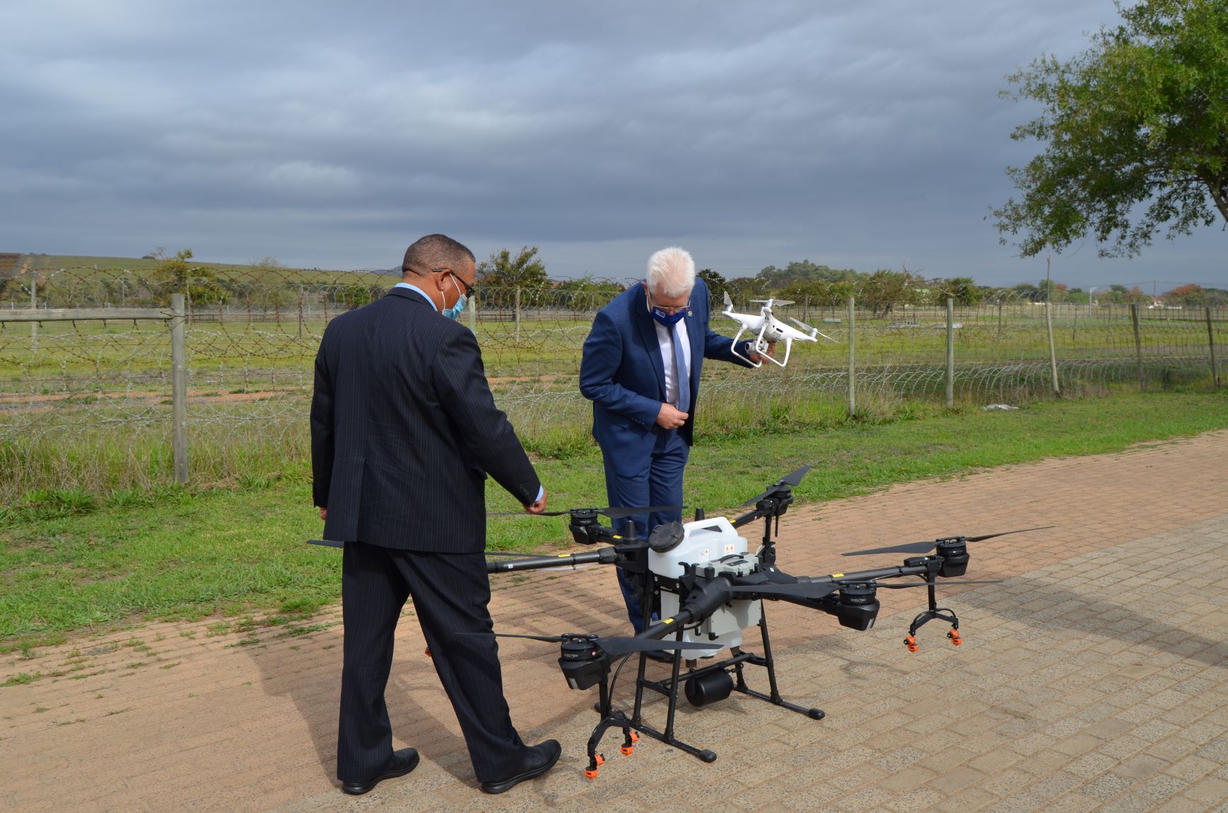 Minister Ivan Meyer and Premier Alan Winde looking at the drone