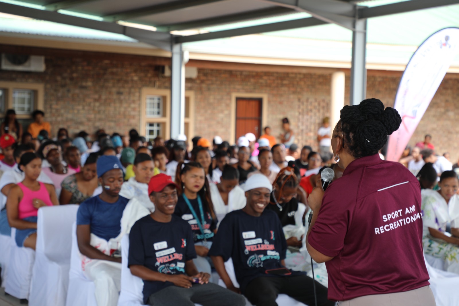 Minister Professor Nomafrench Mbombo engaging with students on the importance of sexual and reproductive health matters and how it affects the overall health of the youth.