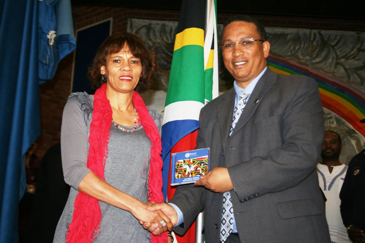 Ms Ronel Beukes (Department of Education) and Dr Ivan Meyer at the National Anthem CD handover ceremony.