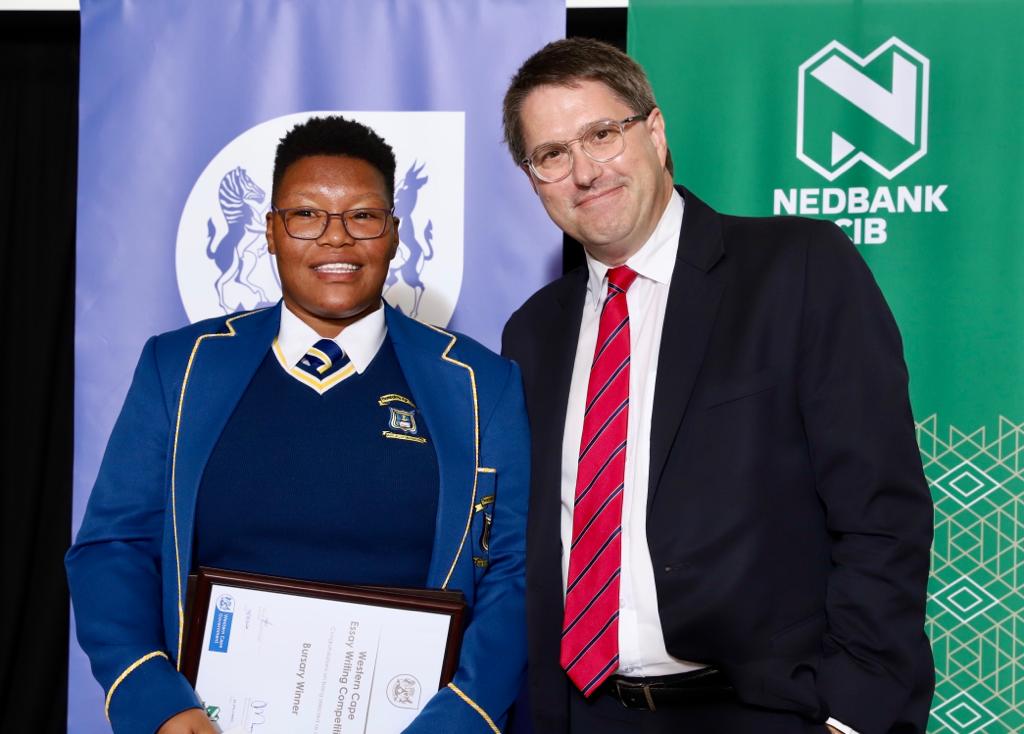 Winner of the Essay Writing Competition, Anesipho Piko with Minister Maynier