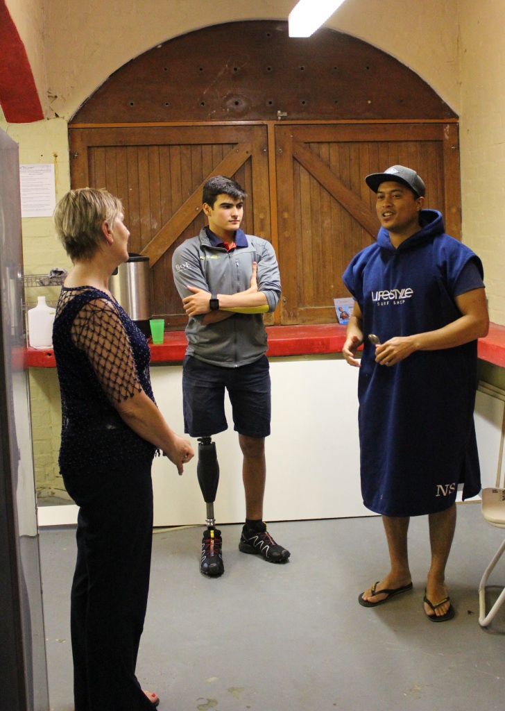 Nigel Savel founder of the 9Miles project giving Minister Anroux Marais and Caleb Swanepoel a tour of their club house at Strandfontein Pavilion.