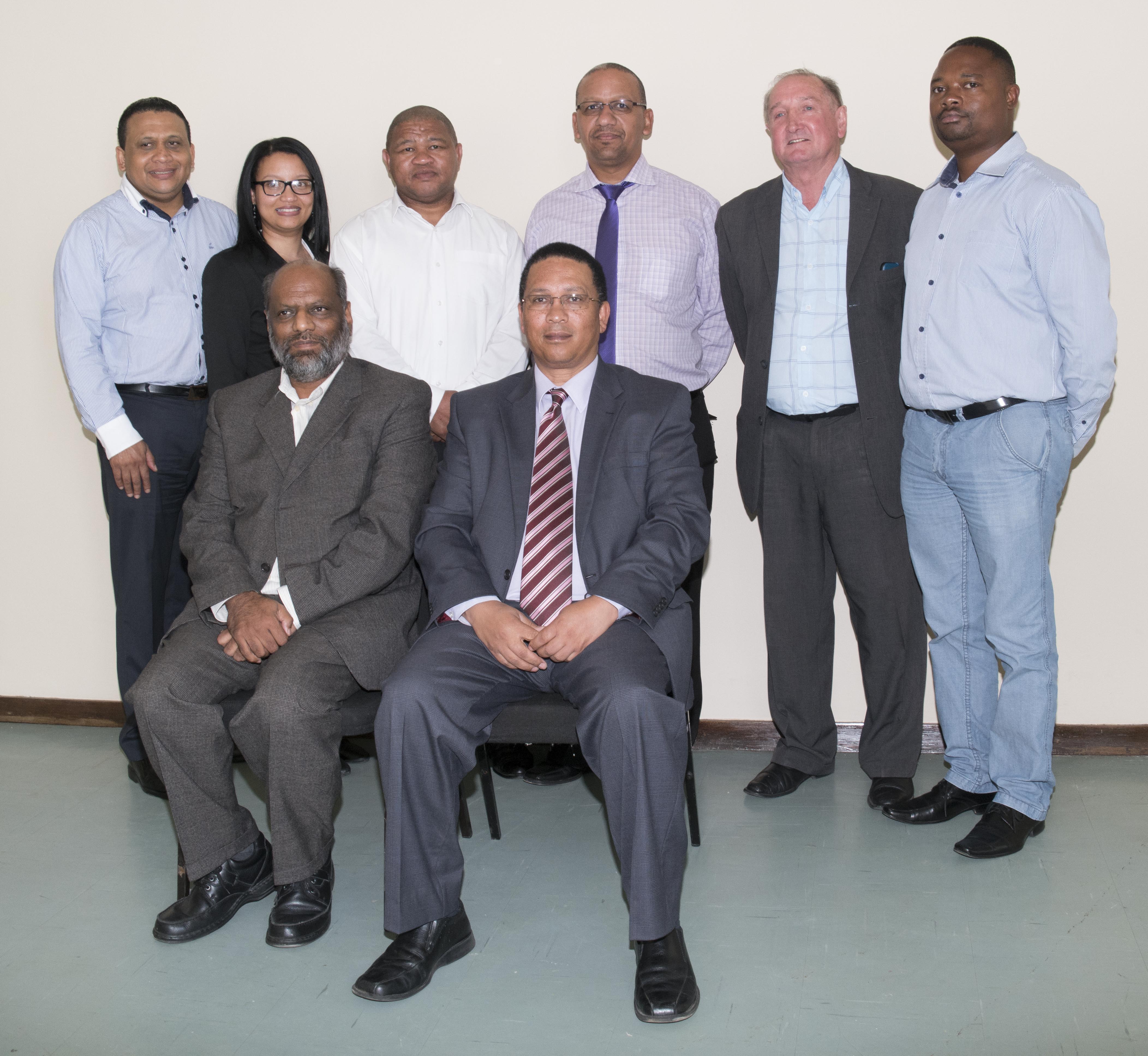 Oudtshoorn Administrator, Kam Chetty, Minister Meyer flanked by officials