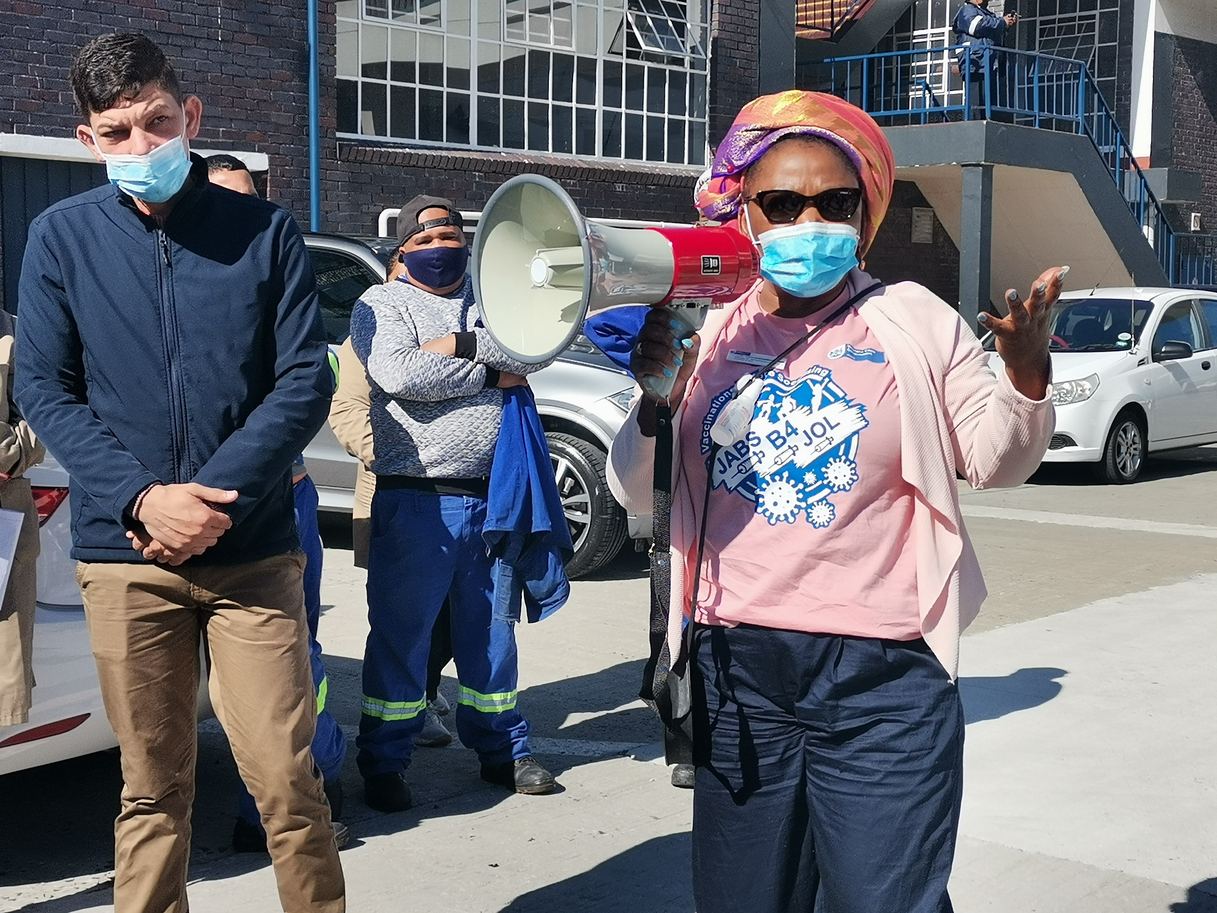Minister of Health Dr Nomafrench Mbombo and Minister of Public Works Daylin Mitchell addressed workers during the vaccination outreach at the Golden Arrow Montana Depot outreach.