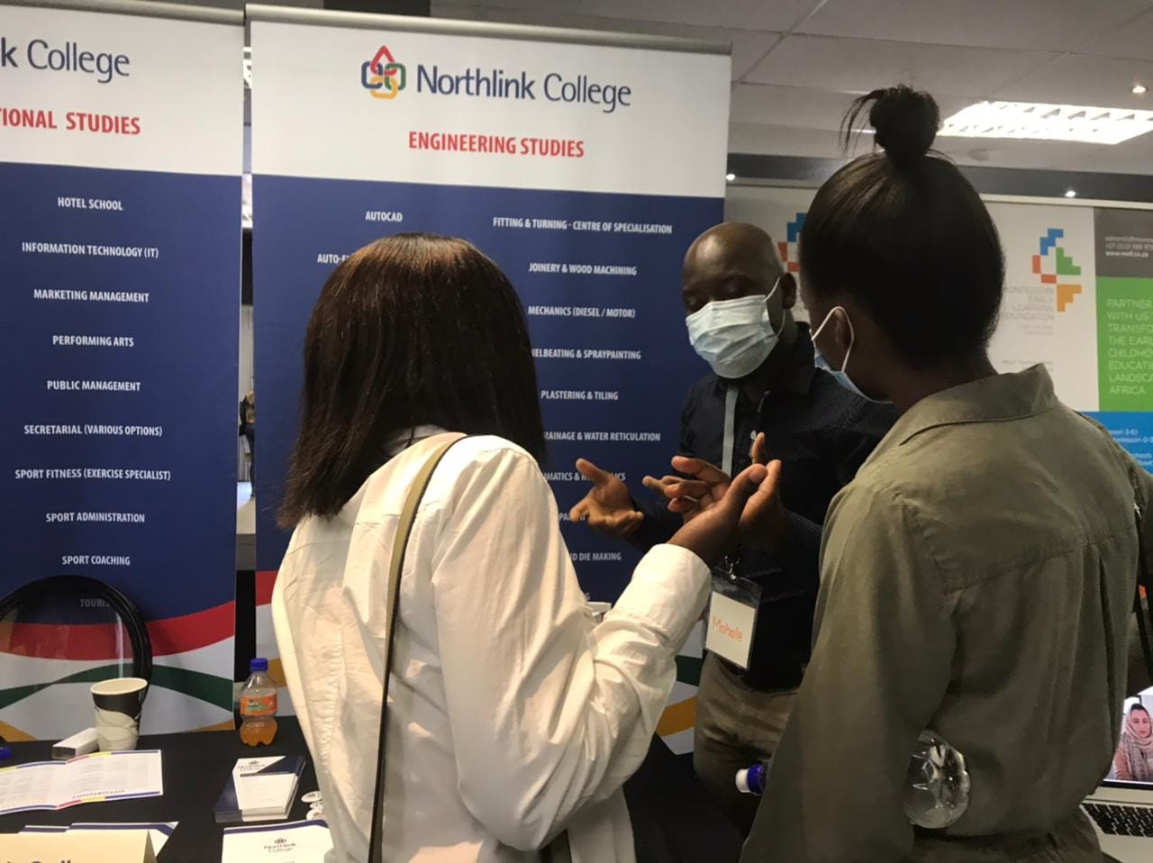 Prospective students getting information from Northlink College.