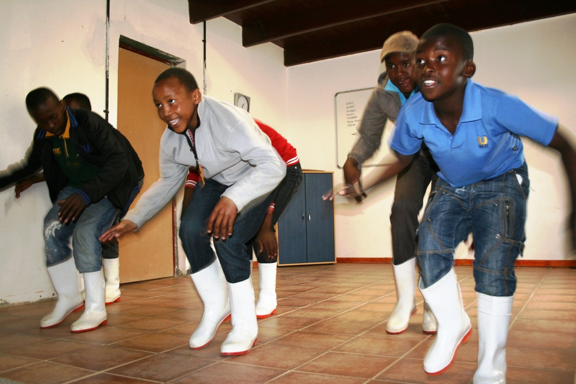 Simphiwe Sabanga, Dennis Masela, Patrick Nkosi and Justice Mahlaba showing their Gum Boot dancing skills.